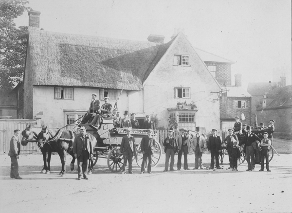 Plough Inn with a group of men in front